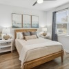 a bedroom with a bed and two nightstands
