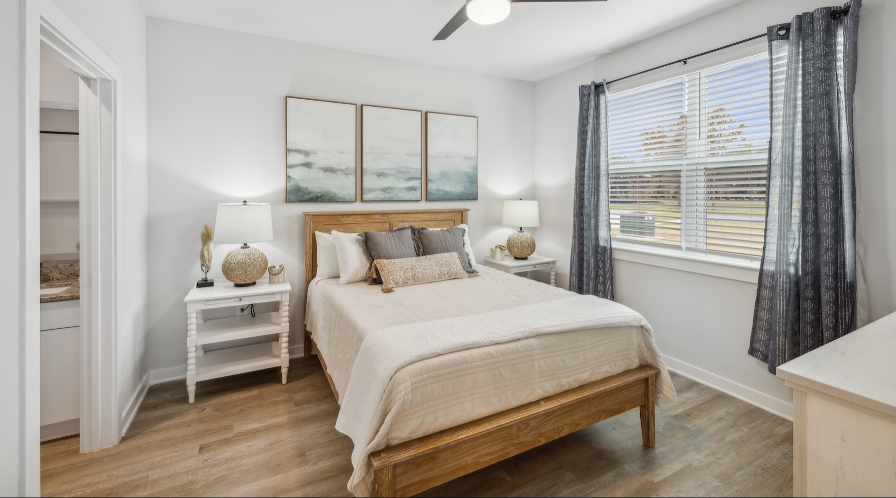 a bedroom with a bed and two nightstands